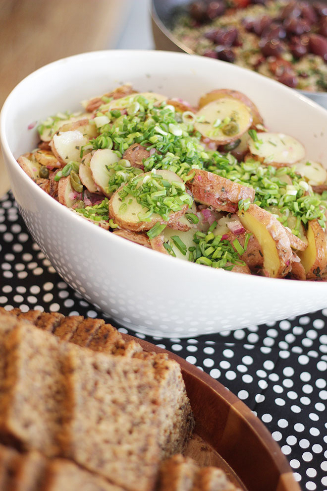 Potato salad covered with herbs